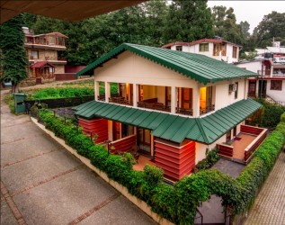 Exterior view of Vikram Vintage Inn, Nainital, showcasing its elegant architecture and scenic surroundings